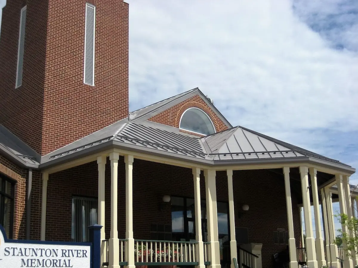 Skilled roofing craftsmen working on a residential roof in Dutcherville